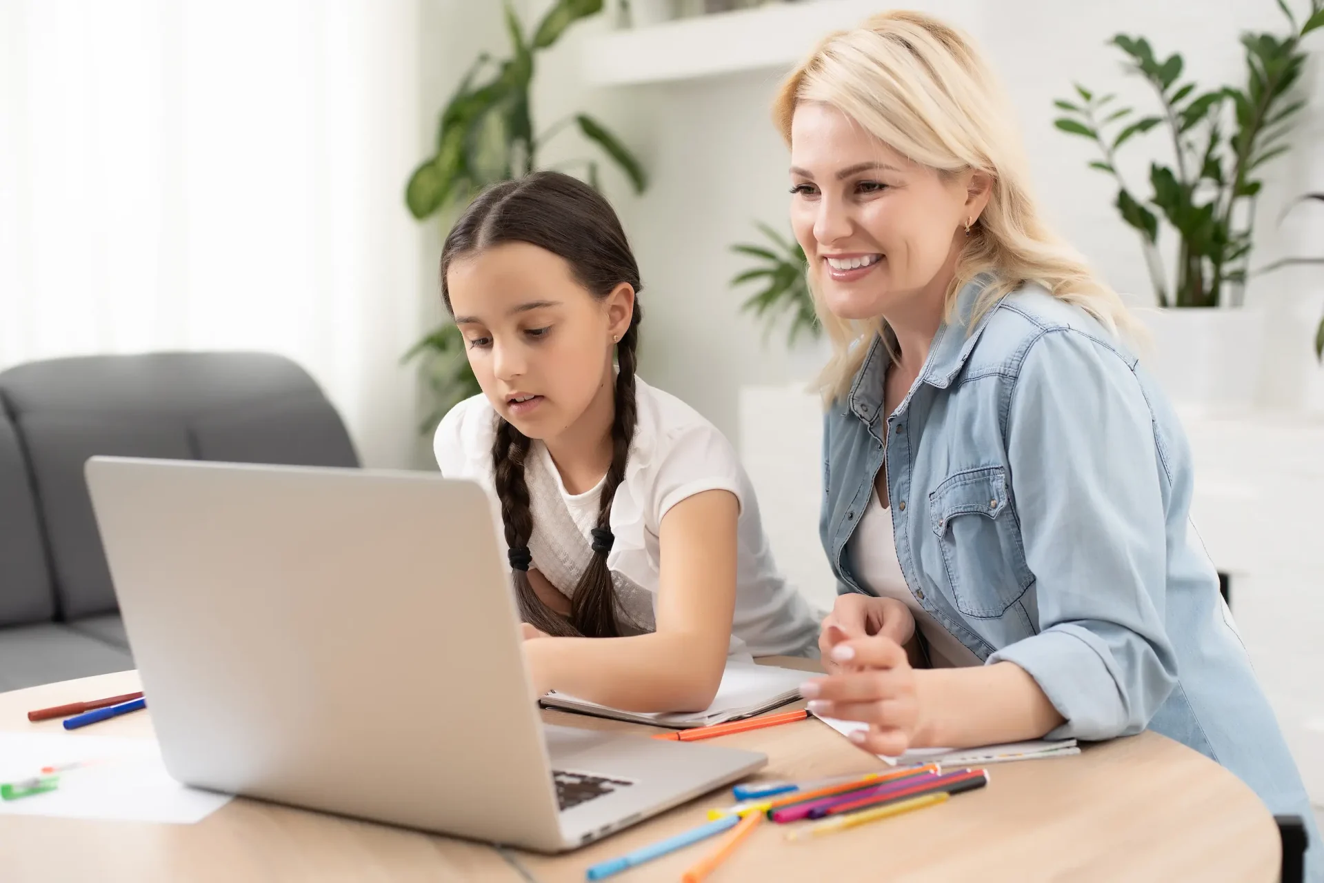 beautiful-young-woman-her-little-cute-daughter-are-using-laptop-home-enjoying-spending-time-together