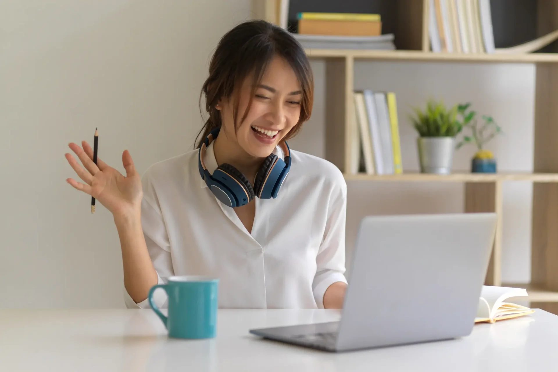 young-woman-using-mobile-phone-while-sitting-table